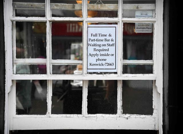(FILES) A photograph taken on June 20, 2022 shows an advert for staff recruiting displayed on the window of a shop, in the town centre of Keswick, in the Lake District, north west England. Britain's unemployment rate rose more than expected to five percent in the third quarter, the highest level since early 2021, official data showed Tuesday ahead of a key UK government budget. The rate increased from 4.7 percent in the second quarter, the Office for National Statistics (ONS) said, ahead of the Labour government's annual budget due November 26 which is set to feature tax rises amid weak UK economic growth. (Photo by Paul ELLIS / AFP)