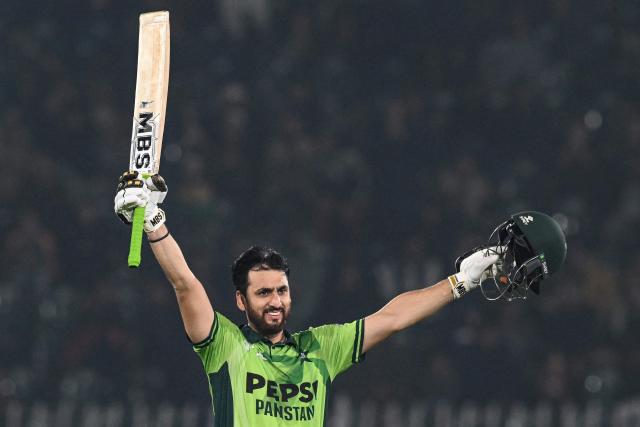 Pakistan's Salman Agha celebrates after scoring a century (100 runs) during the first one-day international (ODI) cricket match between Pakistan and Sri Lanka at the Rawalpindi Cricket Stadium in Rawalpindi on November 11, 2025. (Photo by Aamir QURESHI / AFP)