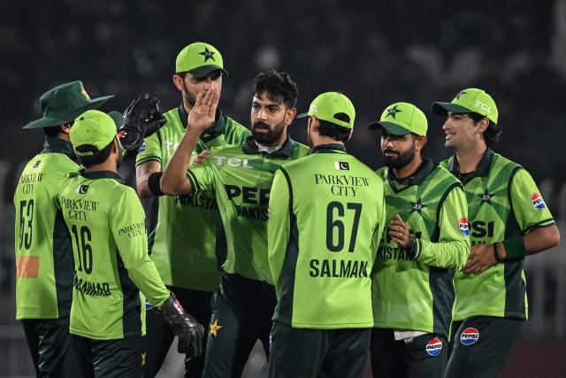Pakistan's Haris Rauf (C) celebrates with teammates after taking the wicket of Sri Lanka's Pathum Nissanka during the first one-day international (ODI) cricket match between Pakistan and Sri Lanka at the Rawalpindi Cricket Stadium in Rawalpindi on November 11, 2025. (Photo by Aamir QURESHI / AFP)