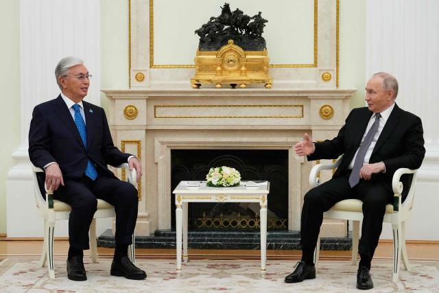 Russian President Vladimir Putin speaks with Kazakh President Kassym-Jomart Tokayev during their meeting at the Senate Palace of the Kremlin in Moscow on November 11, 2025. (Photo by Alexander Zemlianichenko / POOL / AFP)