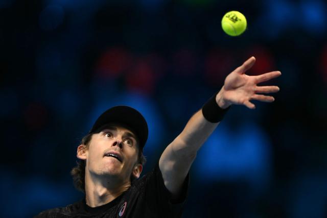 Australia's Alex De Minaur serves against Italy's Lorenzo Musetti at the ATP Finals tennis tournament in Turin on November 11, 2025. (Photo by Marco BERTORELLO / AFP)