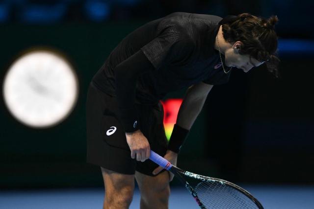 Italy's Lorenzo Musetti reacts during his match against Australia's Alex De Minaur at the ATP Finals tennis tournament in Turin on November 11, 2025. (Photo by Marco BERTORELLO / AFP)