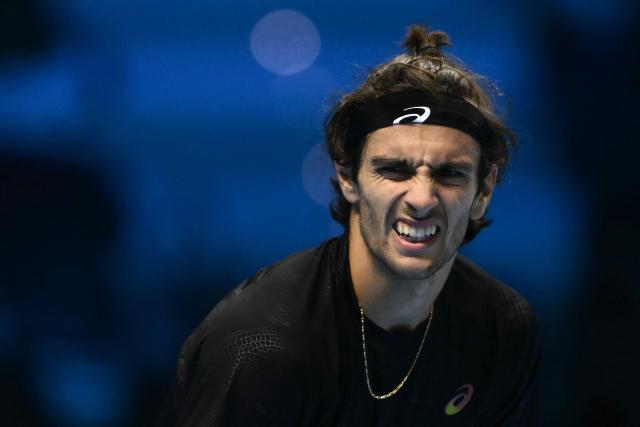 Italy's Lorenzo Musetti reacts during his match against Australia's Alex De Minaur at the ATP Finals tennis tournament in Turin on November 11, 2025. (Photo by Marco BERTORELLO / AFP)