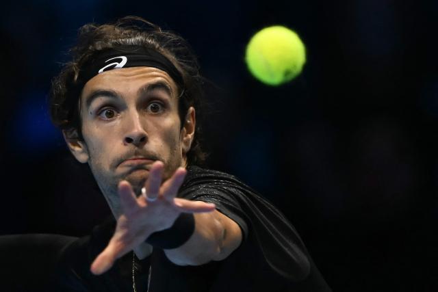 Italy's Lorenzo Musetti eyes the ball during his match against Australia's Alex De Minaur at the ATP Finals tennis tournament in Turin on November 11, 2025. (Photo by Marco BERTORELLO / AFP)
