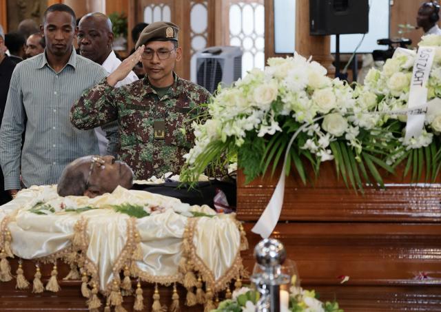 EDITORS NOTE: Graphic content / A member of the military forces attends the funeral of Suriname's three-time former president Ronald Venetiaan at the Petrus and Paulus Cathedral Basilica in Paramaribo on November 11, 2025. Venetiaan, a key architect in the development of the small Dutch-speaking South American country, died Wednesday at the age of 89, his family said. (Photo by Ranu Abhelakh / AFP)