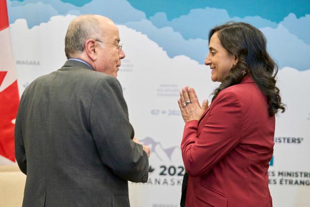 Canadian Foreign Minister Anita Anand greets Brazil’s Foreign Minister Mauro Vieira during a bilateral meeting at the G7 foreign ministers meeting in Niagara-on-the-Lake, Ontario, on November 11, 2025. (Photo by Geoff Robins / AFP)