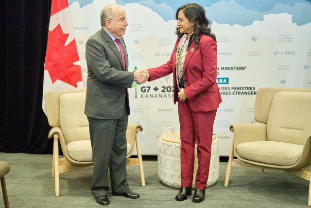 Canadian Foreign Minister Anita Anand greets Brazil’s Foreign Minister Mauro Vieira during a bilateral meeting at the G7 foreign ministers meeting in Niagara-on-the-Lake, Ontario, on November 11, 2025. (Photo by Geoff Robins / AFP)