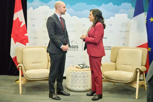 Canadian Foreign Minister Anita Anand greets French Foreign Minister Jean-Noel Barrot during a bilateral meeting at the G7 foreign ministers meeting in Niagara-on-the-Lake, Ontario, on November 11, 2025. (Photo by Geoff Robins / AFP)