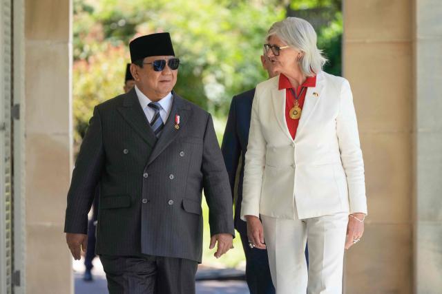 Australia's Governor General Sam Mostyn (R) greets Indonesia's President Prabowo Subianto at Admiralty House in Sydney on November 12, 2025. (Photo by Rick Rycroft / POOL / AFP)