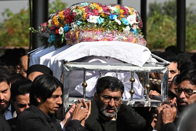Mourners carry the coffin of a lawyer during his funeral in Islamabad on November 12, 2025, a day after suicide bombing. Charred vehicles and a mangled motorcycle lay outside Islamabad's district court on November 11, their metal frames still warm as investigators sealed off the area where a suicide bomber had killed at least 12 people. (Photo by Aamir QURESHI / AFP)