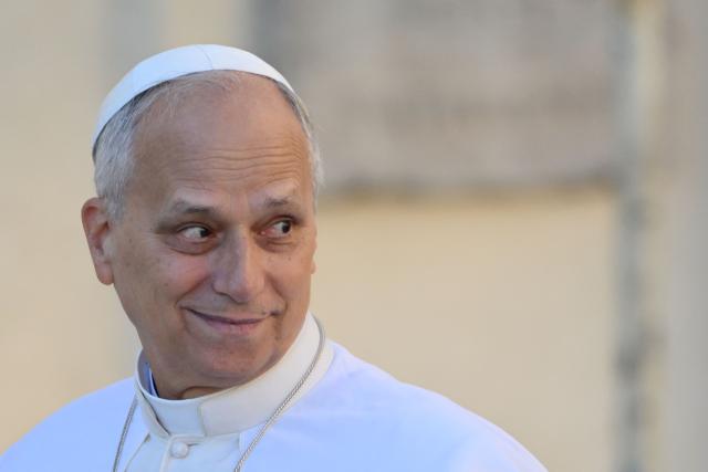 Pope Leo XIV looks on as he arrives for his weekly general audience at St. Peter square in the Vatican on November 12, 2025. (Photo by Alberto PIZZOLI / AFP)