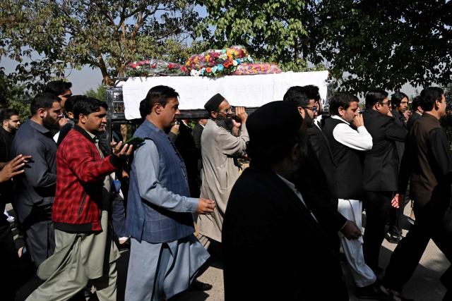 Mourners carry the coffin of a lawyer during his funeral in Islamabad on November 12, 2025, a day after suicide bombing. Charred vehicles and a mangled motorcycle lay outside Islamabad's district court on November 11, their metal frames still warm as investigators sealed off the area where a suicide bomber had killed at least 12 people. (Photo by Aamir QURESHI / AFP)