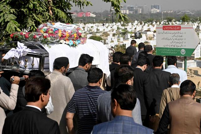 Mourners carry the coffin of a lawyer during his funeral in Islamabad on November 12, 2025, a day after suicide bombing. Charred vehicles and a mangled motorcycle lay outside Islamabad's district court on November 11, their metal frames still warm as investigators sealed off the area where a suicide bomber had killed at least 12 people. (Photo by Aamir QURESHI / AFP)