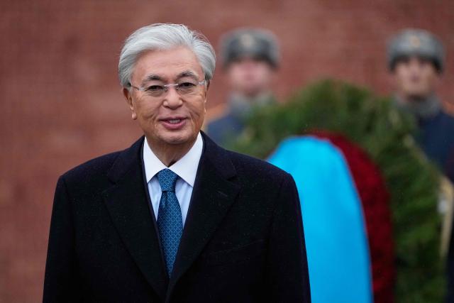 Kazakhstan's President Kassym-Jomart Tokayev attends a wreath-laying ceremony at the Tomb of the Unknown Soldier near the Kremlin wall in Moscow on November 12, 2025, during his state visit to Russia. (Photo by Alexander Zemlianichenko / POOL / AFP)