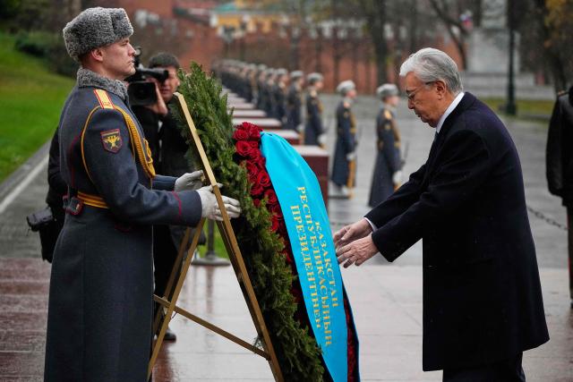 Kazakhstan's President Kassym-Jomart Tokayev attends a wreath-laying ceremony at the Tomb of the Unknown Soldier near the Kremlin wall in Moscow on November 12, 2025, during his state visit to Russia. (Photo by Alexander Zemlianichenko / POOL / AFP)