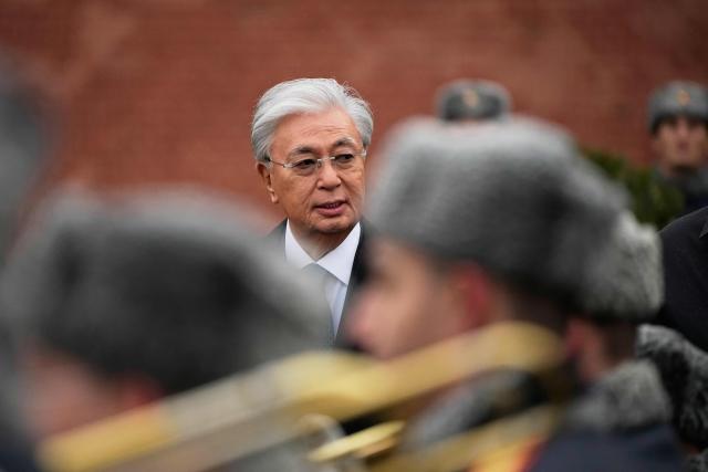 Kazakhstan's President Kassym-Jomart Tokayev attends a wreath-laying ceremony at the Tomb of the Unknown Soldier near the Kremlin wall in Moscow on November 12, 2025, during his state visit to Russia. (Photo by Alexander Zemlianichenko / POOL / AFP)