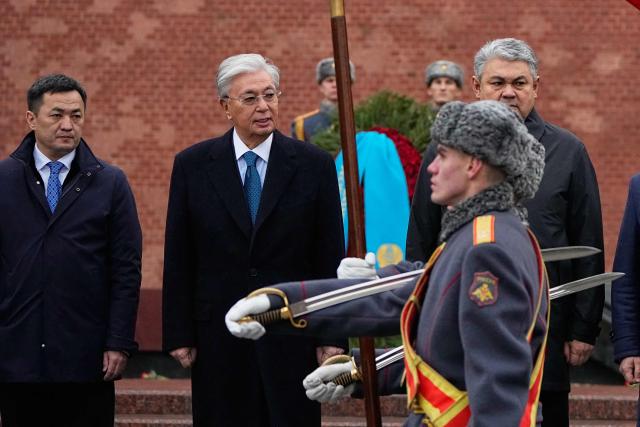 Kazakhstan's President Kassym-Jomart Tokayev attends a wreath-laying ceremony at the Tomb of the Unknown Soldier near the Kremlin wall in Moscow on November 12, 2025, during his state visit to Russia. (Photo by Alexander Zemlianichenko / POOL / AFP)