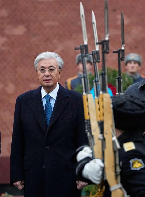 Kazakhstan's President Kassym-Jomart Tokayev attends a wreath-laying ceremony at the Tomb of the Unknown Soldier near the Kremlin wall in Moscow on November 12, 2025, during his state visit to Russia. (Photo by Alexander Zemlianichenko / POOL / AFP)