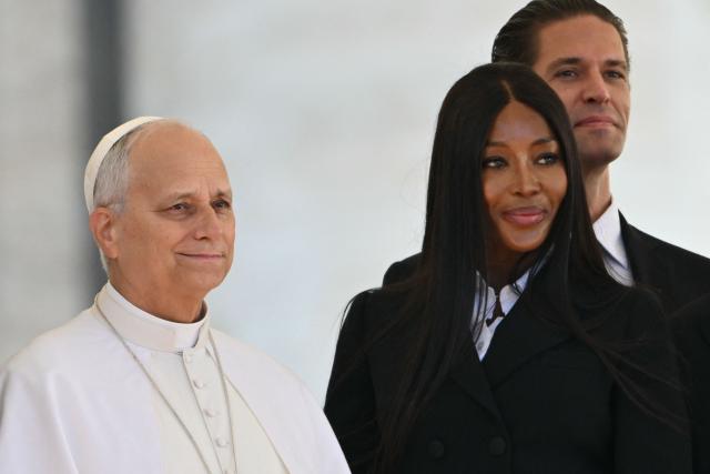 British supermodel and actress Naomi Campbell (front R) stands next to Pope Leo XIV during his weekly general audience at St. Peter square in the Vatican on November 12, 2025. (Photo by Alberto PIZZOLI / AFP)