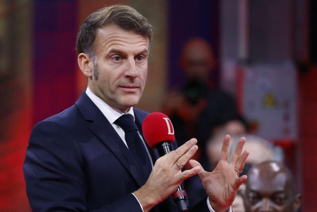 France's President Emmanuel Macron speaks to readers of the newspaper "La Dépêche du Midi" before inaugurating the French Space Command in Toulouse on November 12, 2025. (Photo by Guillaume HORCAJUELO / POOL / AFP)