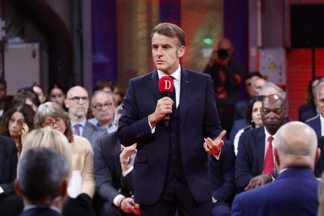 France's President Emmanuel Macron speaks to readers of the newspaper "La Dépêche du Midi" before inaugurating the French Space Command in Toulouse on November 12, 2025. (Photo by Guillaume HORCAJUELO / POOL / AFP)