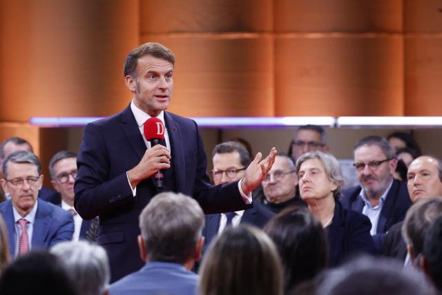 France's President Emmanuel Macron speaks to readers of the newspaper "La Dépêche du Midi" before inaugurating the French Space Command in Toulouse on November 12, 2025. (Photo by Guillaume HORCAJUELO / POOL / AFP)