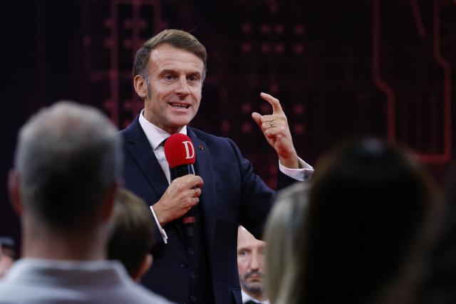 .France's President Emmanuel Macron speaks to readers of the newspaper "La Dépêche du Midi" before inaugurating the French Space Command in Toulouse on November 12, 2025. (Photo by Guillaume HORCAJUELO / POOL / AFP)