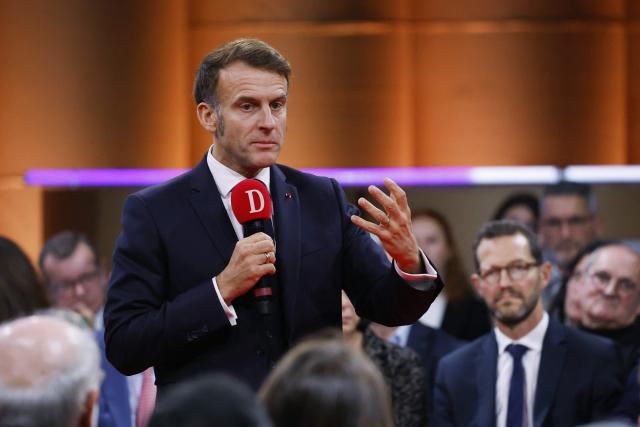 France's President Emmanuel Macron speaks to readers of the newspaper "La Dépêche du Midi" before inaugurating the French Space Command in Toulouse on November 12, 2025. (Photo by Guillaume HORCAJUELO / POOL / AFP)