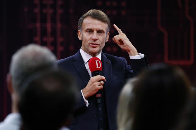 .France's President Emmanuel Macron speaks to readers of the newspaper "La Dépêche du Midi" before inaugurating the French Space Command in Toulouse on November 12, 2025. (Photo by Guillaume HORCAJUELO / POOL / AFP)