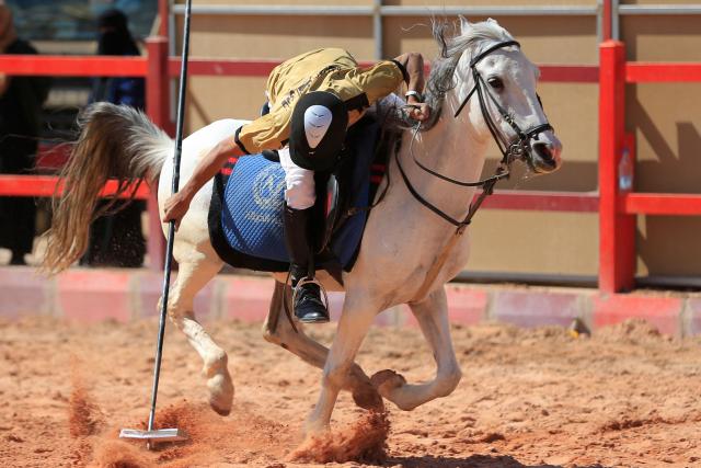 A young athlete participates in a tent-pegging equestrian competition in Yemen's Huthi-controlled capital, Sanaa, on November 12, 2025. (Photo by Mohammed HUWAIS / AFP)