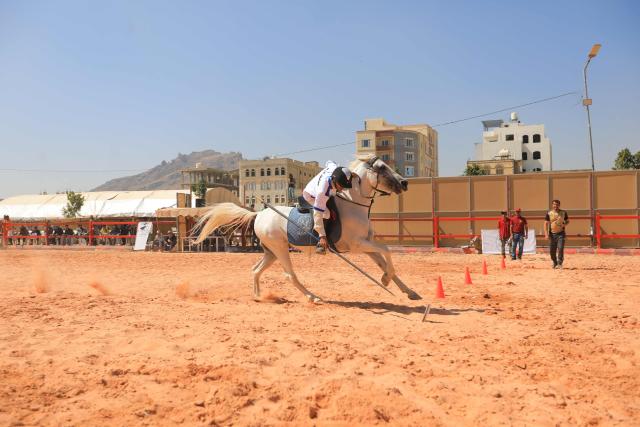 A young athlete participates in a tent-pegging equestrian competition in Yemen's Huthi-controlled capital, Sanaa, on November 12, 2025. (Photo by Mohammed HUWAIS / AFP)