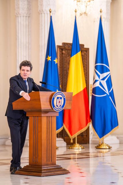 Romanian President Nicusor Dan addresses the media during a press conference at the presidential Cotroceni Palace in Bucharest, Romania, to present the country's new national defence strategy, on November 12, 2025. (Photo by Mihai BARBU / AFP)
