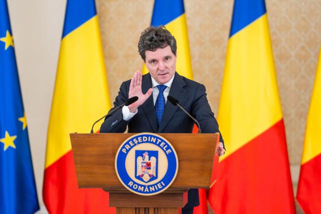 Romanian President Nicusor Dan addresses the media during a press conference at the presidential Cotroceni Palace in Bucharest, Romania, to present the country's new national defence strategy, on November 12, 2025. (Photo by Mihai BARBU / AFP)