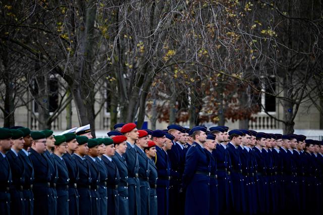 German soldiers stand during a military ceremony to celebrate the 70th anniversary of the German armed forces Bundeswehr, on November 12, 2025 in front of the Chancellery in Berlin. (Photo by Tobias SCHWARZ / AFP)