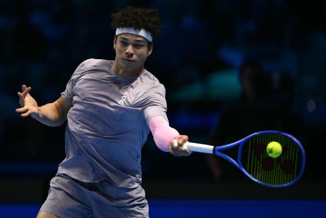 USA's Ben Shelton hits the ball during his match against Canada's Felix Auger-Aliassime at the ATP Finals tennis tournament in Turin on November 12, 2025. (Photo by Marco BERTORELLO / AFP)