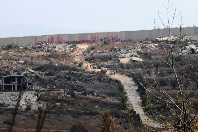 Troops from the United Nations Interim Force in Lebanon (UNIFIL) patrol near the southern Lebanese border village of Kfar Kila on November 12, 2025. Israel has recently intensified its strikes on Lebanon, accusing the Iran-backed Hezbollah group of rearming, nearly a year into a ceasefire that brought an end to their most recent war. (Photo by Rabih DAHER / AFP)