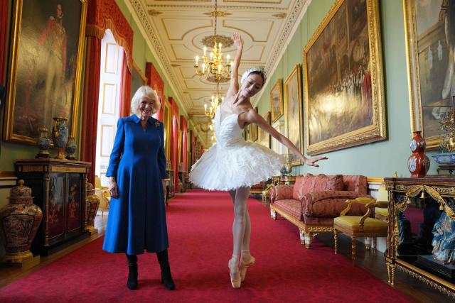 Queen Camilla, reacts as she watches South Korean ballerina Sangeun Lee, during a reception to celebrate the English National Ballet's 75th anniversary, at Buckingham Palace in central London on November 12, 2025. (Photo by Yui Mok / POOL / AFP)