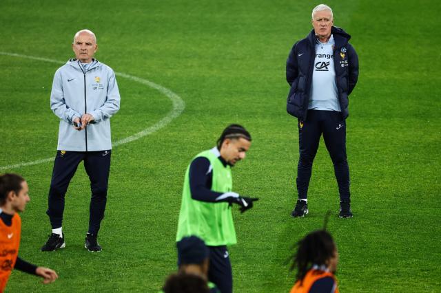 France's head coach Didier Deschamps (R), flanked by his deputy Guy Stephan (L) watch and lead a training session at the Parc des Princes stadium, in Paris, on November 12, 2025 on the eve of the FIFA World Cup 2026 Group D European qualification football match against Ukraine. (Photo by FRANCK FIFE / AFP)