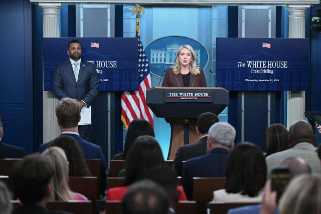 White House Press Secretary Karoline Leavitt speaks as FBI Director Kash Patel (L) looks on during the daily briefing in the Brady Briefing Room of the White House in Washington, DC, on November 12, 2025. (Photo by Brendan SMIALOWSKI / AFP)