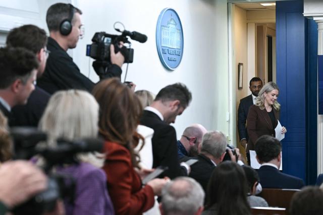 White House Press Secretary Karoline Leavitt and FBI Director Kash Patel arrive for a press briefing in the Brady Briefing Room of the White House in Washington, DC, on November 12, 2025. (Photo by Brendan SMIALOWSKI / AFP)