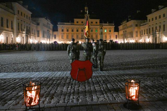 Recruits of the Franco-German Brigade take the solemn oath during a ceremony at Ludwigsburg Castle in Ludwigsburg, southwestern Germany, on November 12, 2025. 250 recruits of the Artillery Bataillon 295 and the Hunter Bataillon 292 take their solemn oath on the 70th anniversary of the founding of the German armed forces Bundeswehr. (Photo by THOMAS KIENZLE / AFP)