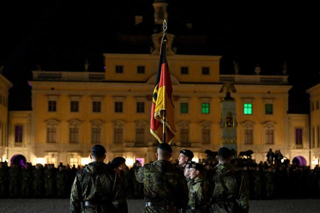 Recruits of the Franco-German Brigade take the solemn oath during a ceremony at Ludwigsburg Castle in Ludwigsburg, southwestern Germany, on November 12, 2025. 250 recruits of the Artillery Bataillon 295 and the Hunter Bataillon 292 take their solemn oath on the 70th anniversary of the founding of the German armed forces Bundeswehr. (Photo by THOMAS KIENZLE / AFP)