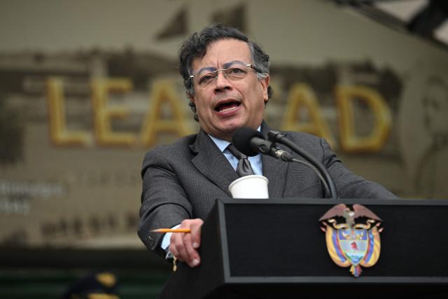 (FILES) Colombia's President Gustavo Petro delivers a speech in front of Colombia's new Minister of Defense, General Pedro Sanchez (out of frame), during a troop recognition ceremony at the Jose Maria Cordova Military Cadet School in Bogota on March 11, 2025. Colombian President Gustavo Petro on November 11, 2025, paused all US intelligence exchange in response to Washington's bombings of multiple alleged drug-trafficking vessels in the Caribbean and the Pacific, which have killed at least 76 people. (Photo by RAUL ARBOLEDA / AFP)