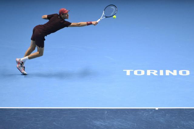 Italy's Jannik Sinner hits the ball during his match against Germany's Alexander Zverev at the ATP Finals tennis tournament in Turin on November 12, 2025. (Photo by Marco BERTORELLO / AFP)