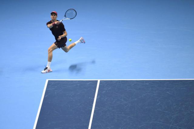 Italy's Jannik Sinner hits the ball during his match against Germany's Alexander Zverev at the ATP Finals tennis tournament in Turin on November 12, 2025. (Photo by Marco BERTORELLO / AFP)