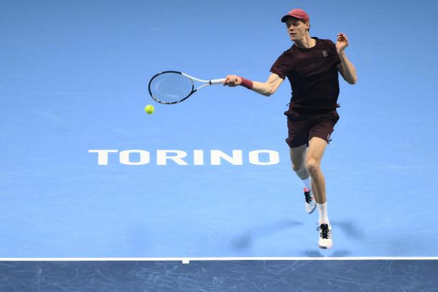 Italy's Jannik Sinner hits the ball during his match against Germany's Alexander Zverev at the ATP Finals tennis tournament in Turin on November 12, 2025. (Photo by Marco BERTORELLO / AFP)