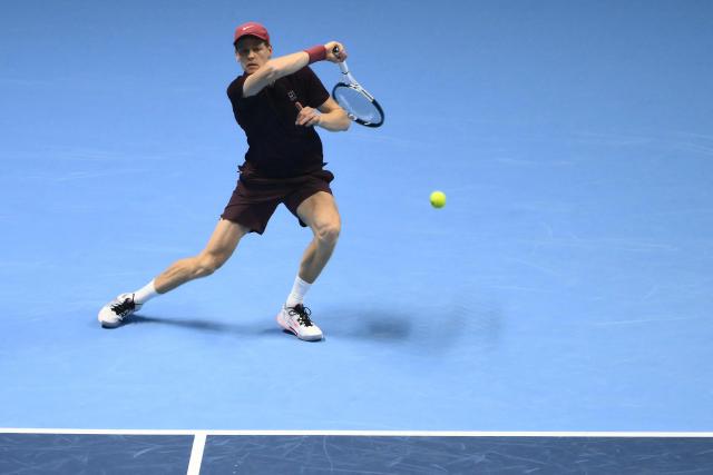 Italy's Jannik Sinner hits the ball during his match against Germany's Alexander Zverev at the ATP Finals tennis tournament in Turin on November 12, 2025. (Photo by Marco BERTORELLO / AFP)