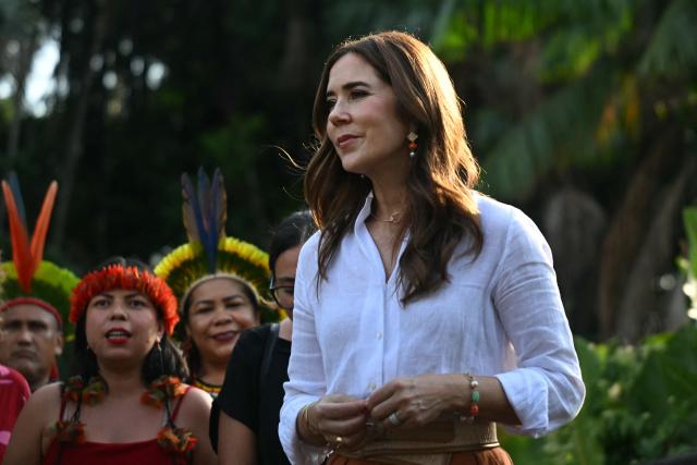 Denmark's Queen Mary (R) stands next to local Indigenous leaders during her visit at Utinga Park in the sidelines of the COP30 UN Climate Change Conference in Belem, Para State, Brazil on November 12, 2025. (Photo by Mauro PIMENTEL / AFP)