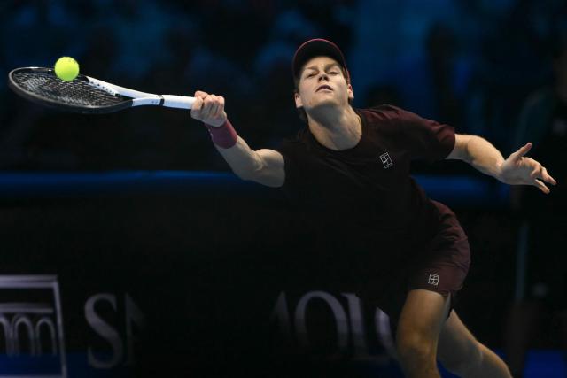 Italy's Jannik Sinner hits the ball during his match against Germany's Alexander Zverev at the ATP Finals tennis tournament in Turin on November 12, 2025. (Photo by Marco BERTORELLO / AFP)
