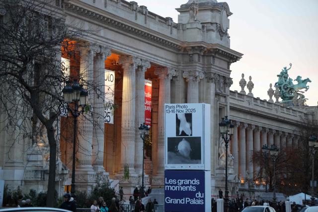 A general view shows the main entrance to the 28th edition of the Paris Photo international fair at the Grand Palais museum in Paris on November 12, 2025. (Photo by Ludovic MARIN / AFP)